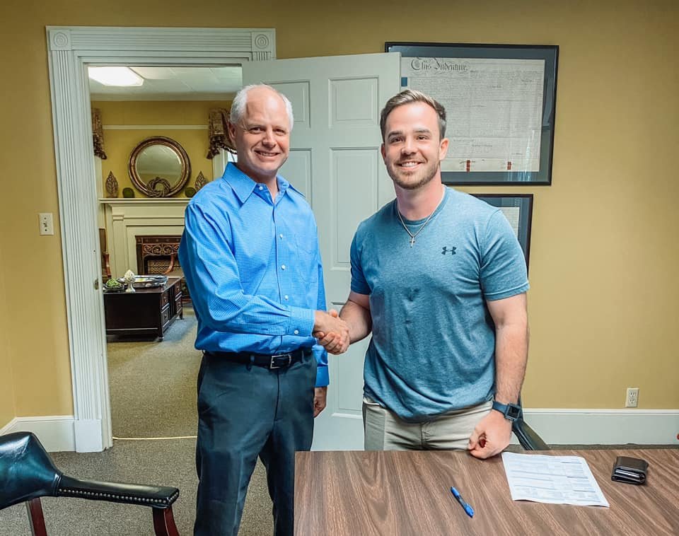Keith Queen with a homebuyer at closing